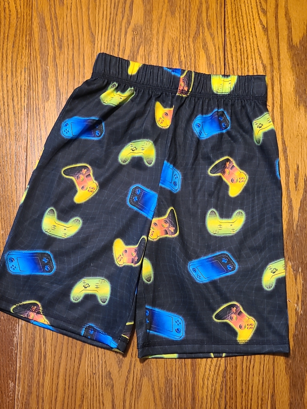 Cuddl Duds Black Shorts with Blue and Yellow Gaming Controller Print